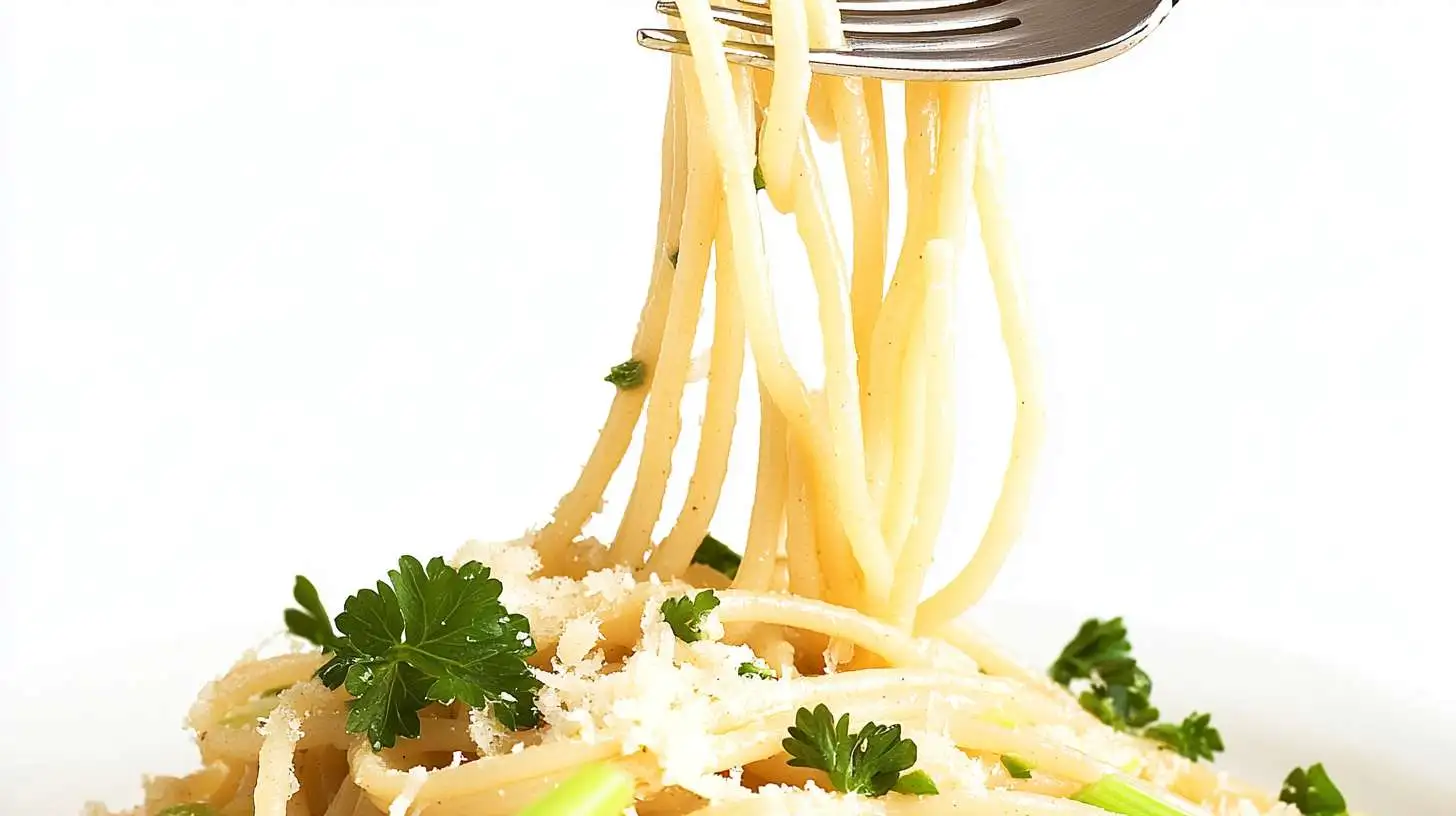 A fork lifts strands of angel hair pasta sprinkled with grated cheese and garnished with fresh parsley.